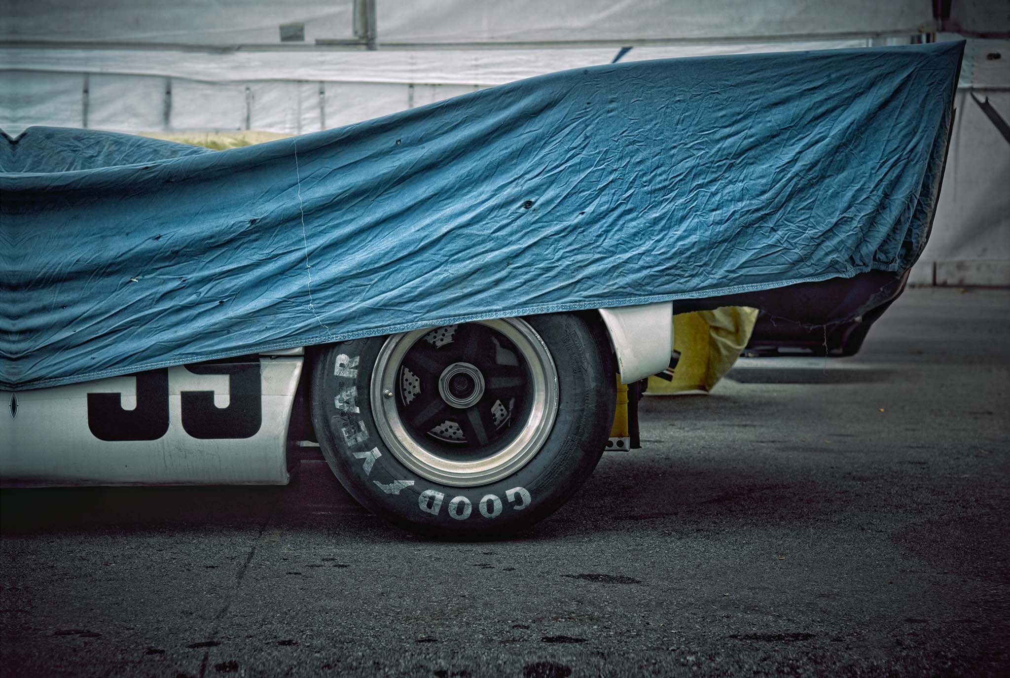 THE CURTAIN fine art photograph by Frank Kayser showing working vehicle in a urban still life (Laguna Seca – Rennsport Reunion)