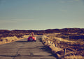 Patinated Porsche 356 Speedster with surfboard on a dune road in Sylt, cinematic summer freedom, coastal fine art photograph