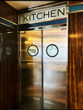 Modernist interior composition of stainless steel and warm wood by Frank Kayser