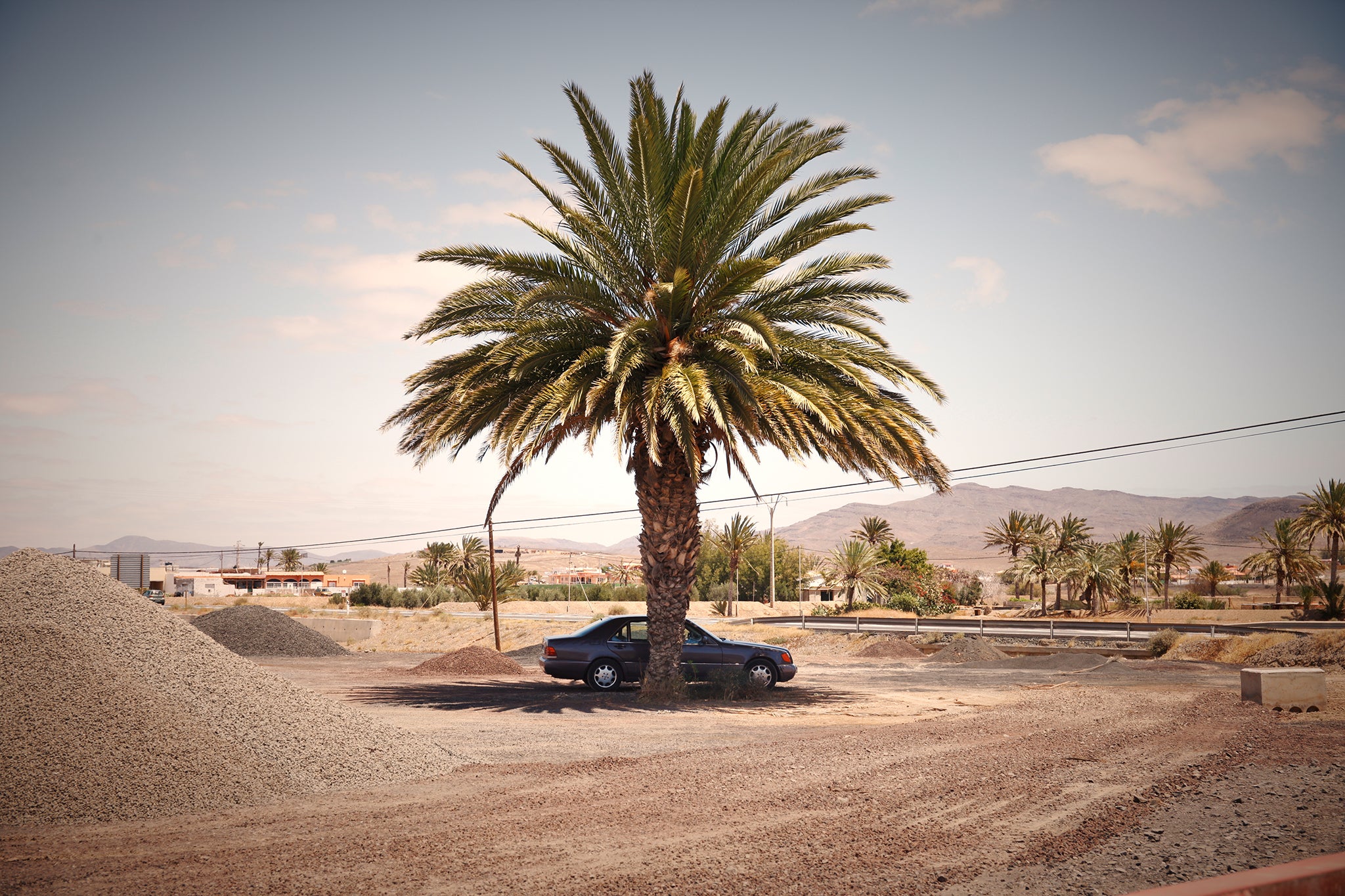 A Garage fine art photograph by Frank Kayser showing working vehicle in a urban still life (Fuerteventura – Desert Fringe)