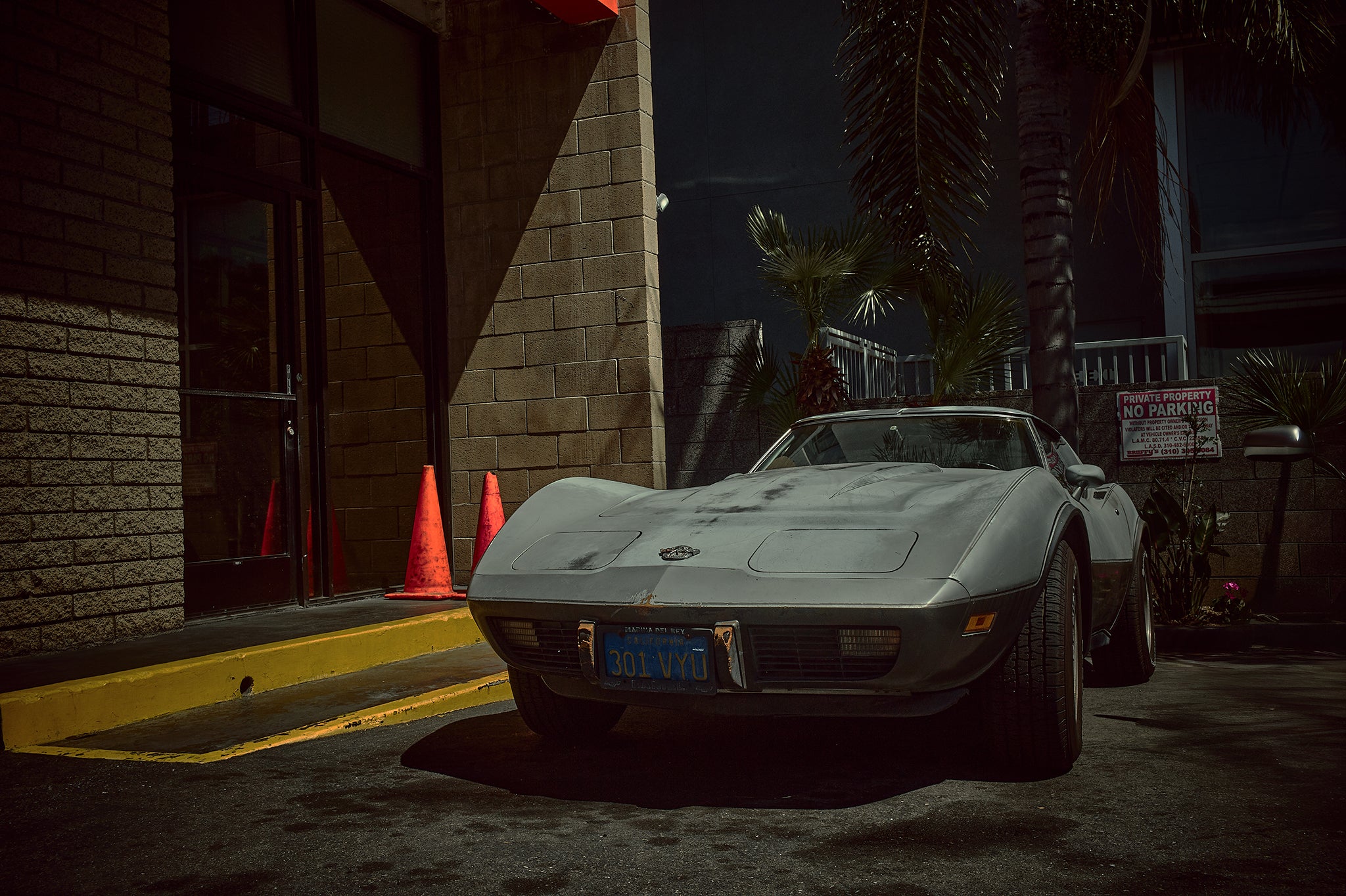 A Little Matt Corvette by Frank Kayser — aged grey Corvette in a nocturnal Venice Beach courtyard