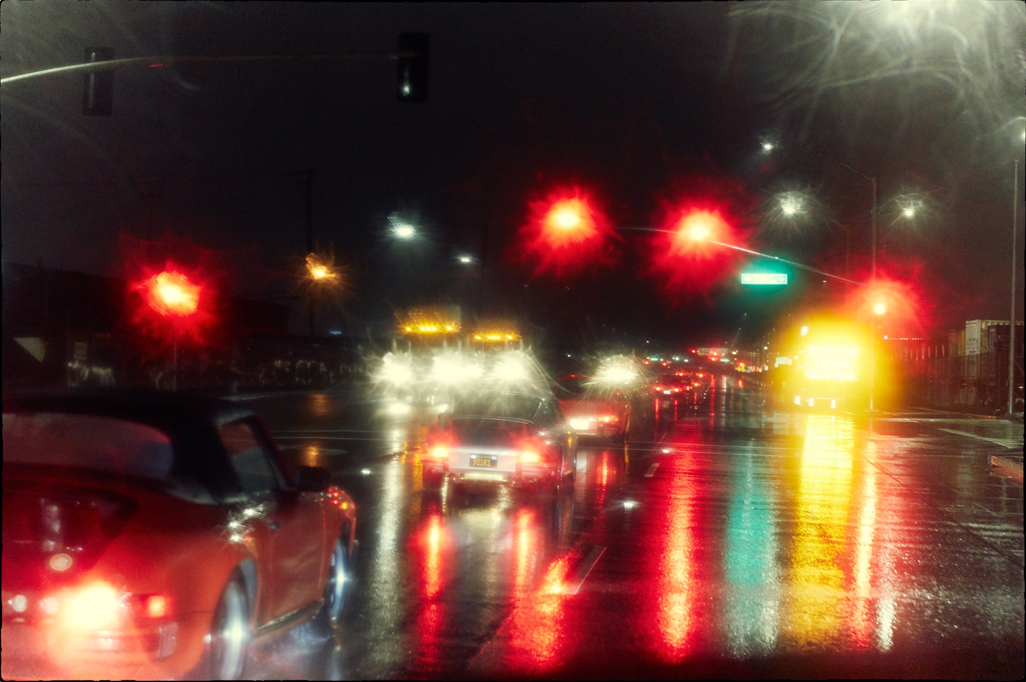 Raindance fine art photograph by Frank Kayser showing working vehicle in a urban still life (San Francisco Night · RBook Production · R Gruppe 2019)